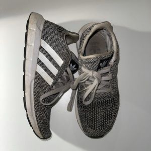 Grey and white adidas athletic shoes